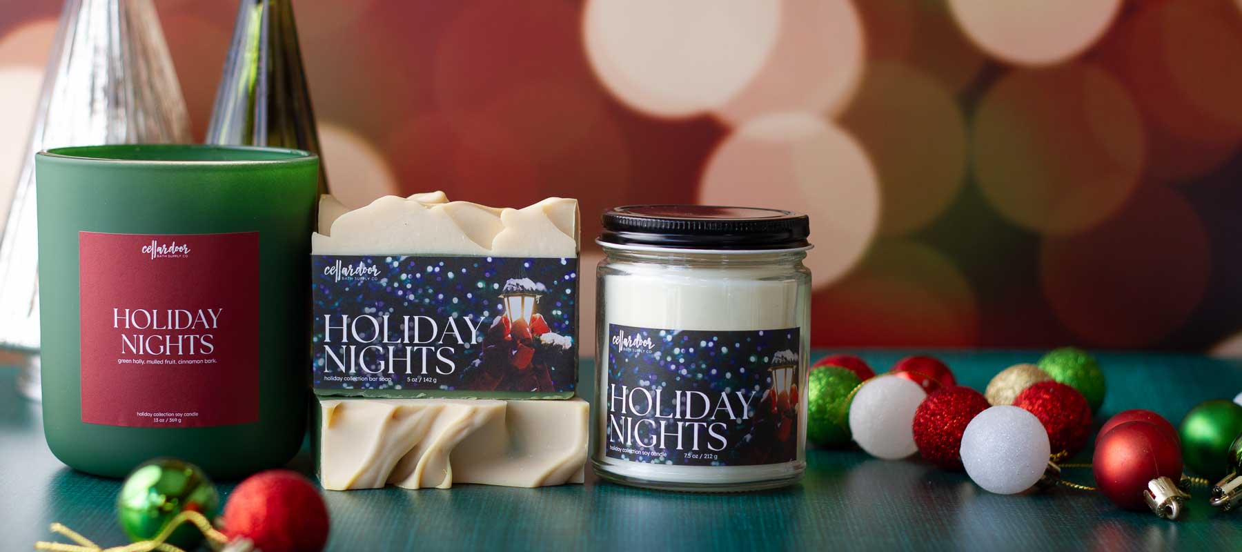 Candle and soap set with 'Holiday Nights' branding on a festive background