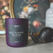 Purple candle labeled 'Nocturnal Bloom' with a blurred background