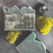 Obsidian Mist soap with packaging on a dark surface